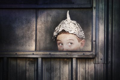 Attached picture bigstock-Boy-in-a-tin-foil-hat-peeking-smaller-40667101.jpg